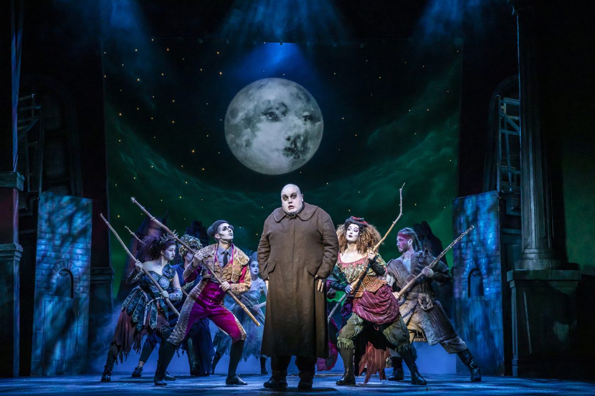 Scott Paige as Uncle Fester with the ensemble of THE ADDAMS FAMILY. Credit Pamela Raith